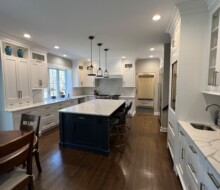 Elegant Kitchen Remodel with Custom Wood Cabinetry and Stone Backsplash in New Jersey